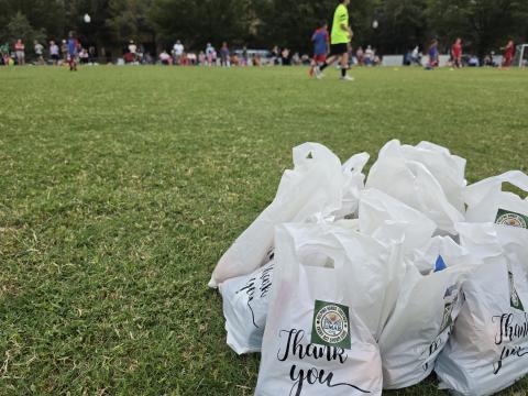 Sharing Goody Bags with Soccer Kids